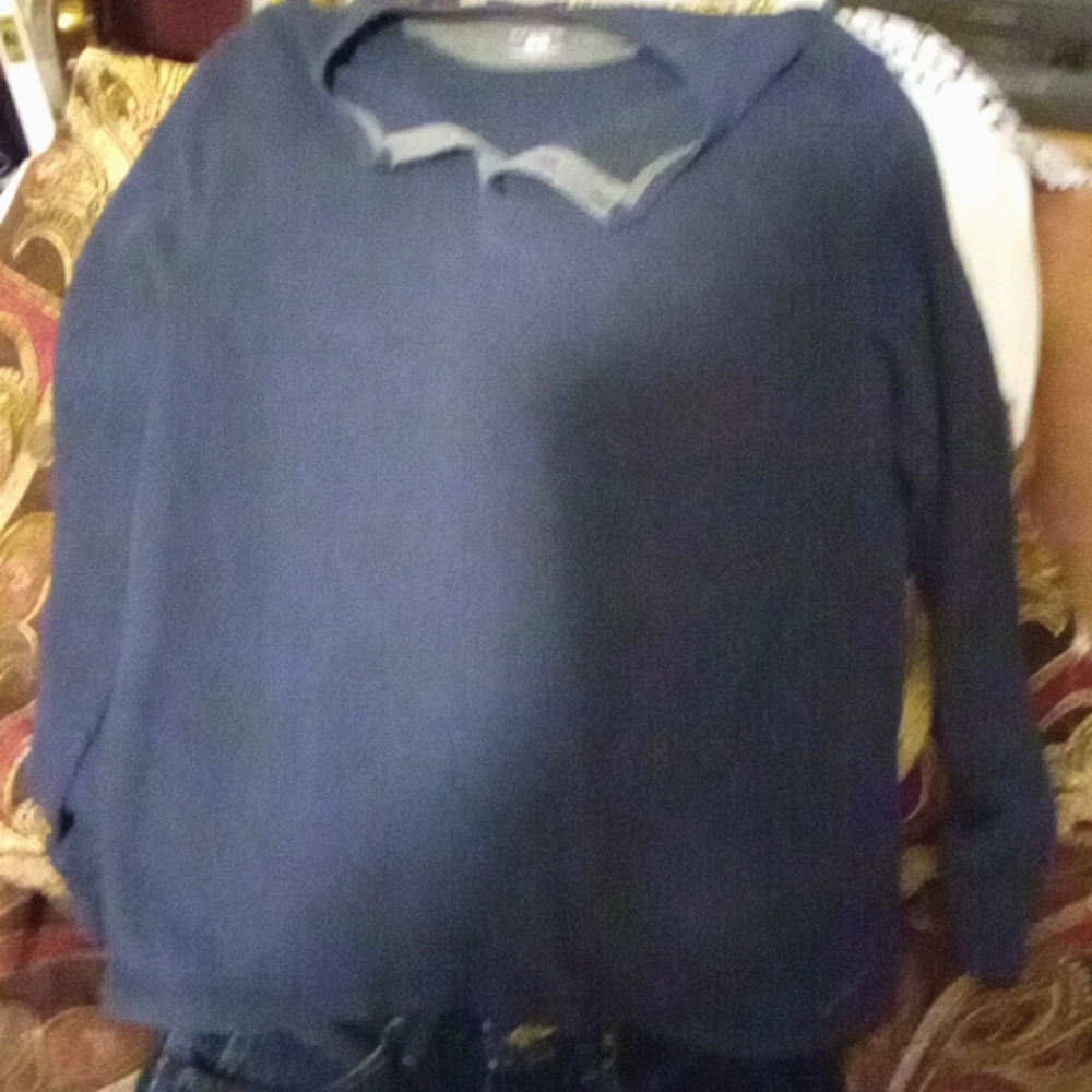 It is a long sleeve shirt dark blue it looks faded in the picture but they're no